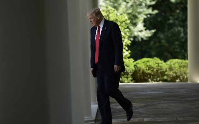 US President Donald Trump arrives to announce his decision to withdraw the US from the Paris Climate Accords, in the Rose Garden of the White House in Washington, DC, on June 1, 2017. (AFP PHOTO / Brendan Smialowski) US President Donald Trump arrives to announce his decision to withdraw the US from the Paris Climate Accords, in the Rose Garden of the White House in Washington, DC, on June 1, 2017. (AFP PHOTO / Brendan Smialowski)