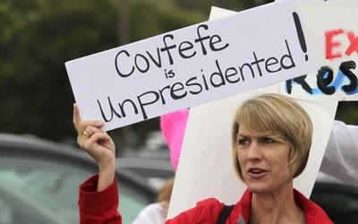 Demonstrator Annette Lievers carries a sign concerning a recent Trump tweet as she joined about 200 demonstrators before a town hall meeting with Republican US Representative Darrell Issa at a high school in San Juan Capistrano, California, on June 3, 2017. (AFP PHOTO / Bill Wechter)