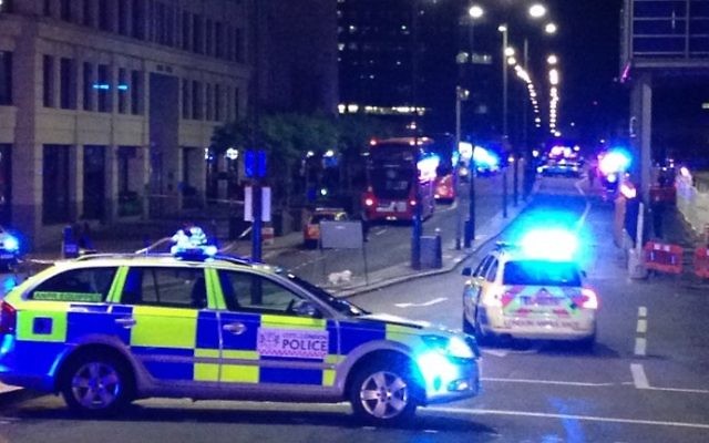 Illustration: A photograph taken on a mobile phone shows British police cars blocking the entrance to London Bridge, in central London on June 3, 2017, following an attack on the bridge. (AFP PHOTO / Daniel SORABJI) Illustration: A photograph taken on a mobile phone shows British police cars blocking the entrance to London Bridge, in central London on June 3, 2017, following an attack on the bridge. (AFP PHOTO / Daniel SORABJI)