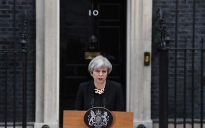 Britain's Prime Minister Theresa May delivers a statement outside 10 Downing Street in central London on June 4, 2017, following the June 3 terror attack.(AFP Photo/Justin Tallis)