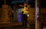Police are pictured in the Melbourne bayside suburb of Brighton on June 5, 2017, after a woman was held hostage in an apartment block in an incident authorities are investigating as a possible terror attack. (AFP Photo/Mal Fairclough)