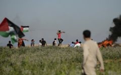 Palestinian protesters throw stones towards Israeli security forces during clashes following a demonstration against the blockade on the Gaza Strip, near the border fence east of Jabalia refugee camp on June 5, 2017. (AFP/Mahmud Hams)