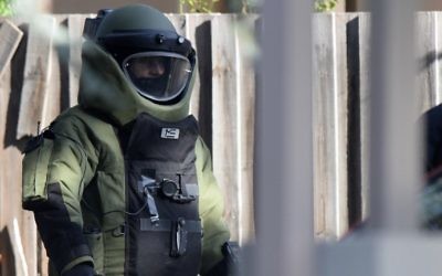 A special operations officer wears a bomb suit at the scene of a shootout in the Melbourne bayside suburb of Brighton on June 6, 2017. (Mal Fairclough / AFP)