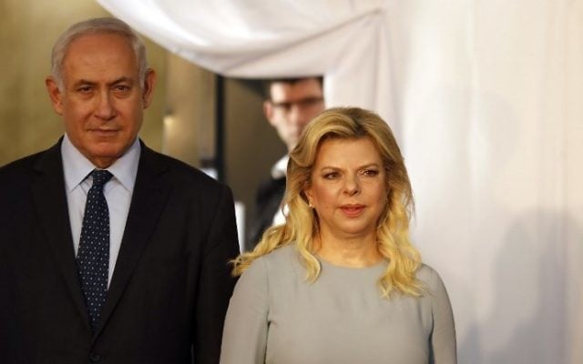 Prime Minister Benjamin Netanyahu and his wife Sara wait for the arrival of the Ethiopian prime minister and his wife ahead of a welcoming ceremony at the Prime Minister's Office in Jerusalem on June 6, 2017. (AFP Photo/Gali Tibbon) Prime Minister Benjamin Netanyahu and his wife Sara wait for the arrival of the Ethiopian prime minister and his wife ahead of a welcoming ceremony at the Prime Minister's Office in Jerusalem on June 6, 2017. (AFP Photo/Gali Tibbon)