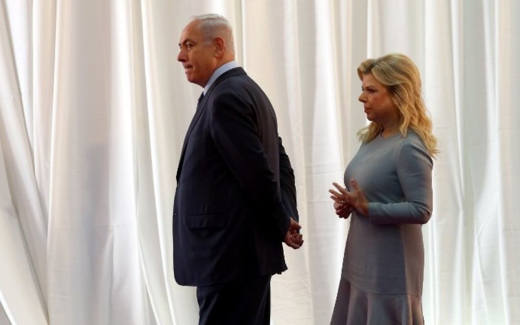 Prime Minister Benjamin Netanyahu and his wife Sara wait for the arrival of the Ethiopian prime minister and his wife ahead of a welcoming ceremony at the Prime Minister's Office in Jerusalem on June 6, 2017. (AFP Photo/Gali Tibbon) Prime Minister Benjamin Netanyahu and his wife Sara wait for the arrival of the Ethiopian prime minister and his wife ahead of a welcoming ceremony at the Prime Minister's Office in Jerusalem on June 6, 2017. (AFP Photo/Gali Tibbon)