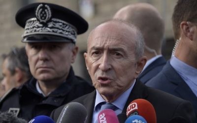 French Interior Minister Gerard Collomb (C) addresses the media near the site of an attack at the entrance of Notre Dame cathedral in Paris on June 6, 2017. (AFP Photo/Bertrand Guay)
