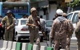 Members of the Iranian Revolutionary Guard secure the area outside the Iranian parliament during an attack on the complex in the capital Tehran on June 7, 2017. (AFP/Fars News/Hossein Mersadi)