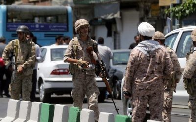 Members of the Iranian Revolutionary Guard secure the area outside the Iranian parliament during an attack on the complex in the capital Tehran on June 7, 2017. (AFP/Fars News/Hossein Mersadi)