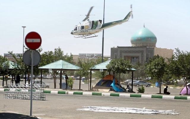 A police helicopter flying around outside the mausoleum of Ayatollah Ruhollah Khomeini in Tehran, Iran, June 7, 2017. (AFP/MIZA NEWS/Hasan SHIRVANI)