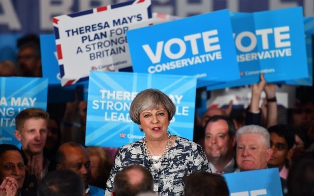Britain's Prime Minister and leader of the Conservative Party Theresa May speaks during a general election campaign rally in Birmingham on June 7, 2017. (AFP PHOTO / BEN STANSALL)