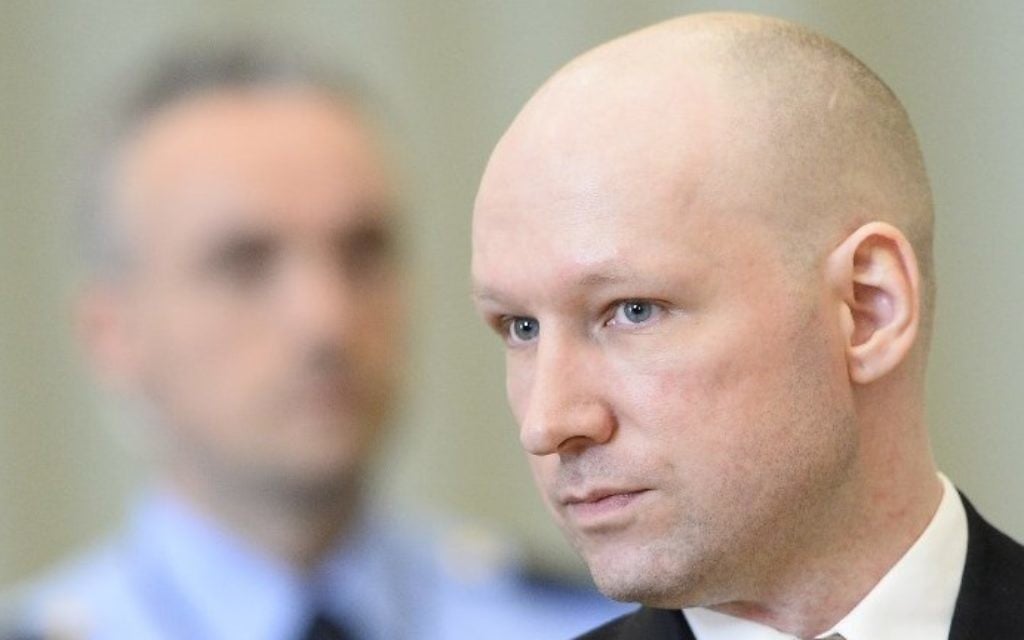 This file photo taken on March 15, 2016 shows Norwegian mass killer Anders Behring Breivik (R) returning to a makeshift court in Skien prisons gym after a lunch break in Skien, some 130 km south west of Oslo, for his lawsuit against the Norwegian state   ( AFP PHOTO / JONATHAN NACKSTRAND)