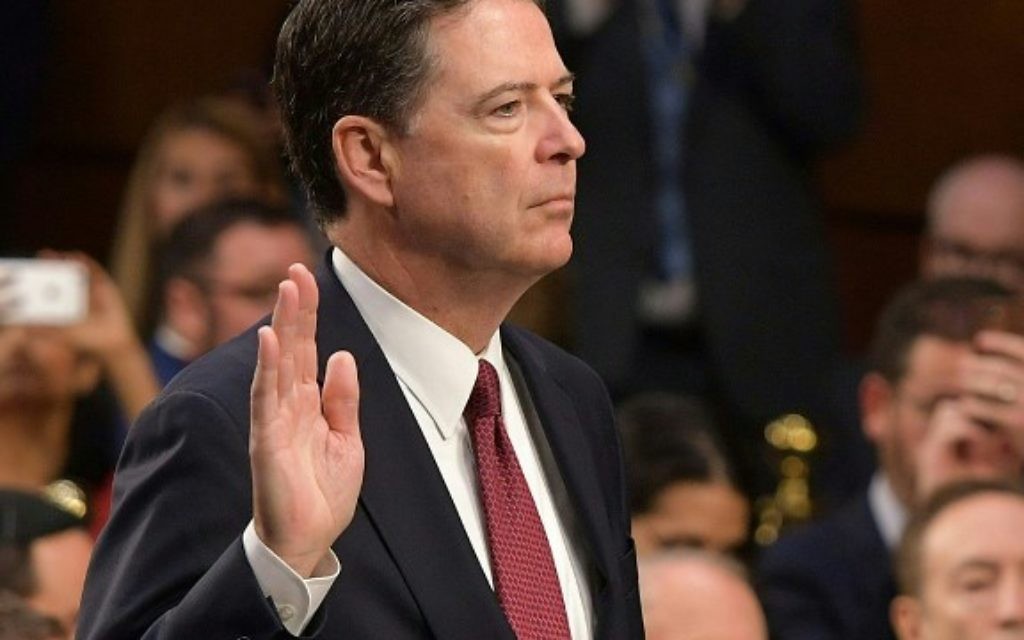 Former FBI Director James Comey takes the oath before he testifies during a US Senate Select Committee on Intelligence hearing on Capitol Hill in Washington,DC, June 8, 2017. (AFP PHOTO / Mandel NGAN)