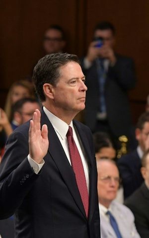 Former FBI Director James Comey takes the oath before he testifies during a US Senate Select Committee on Intelligence hearing on Capitol Hill in Washington,DC, June 8, 2017. (AFP PHOTO / Mandel NGAN)