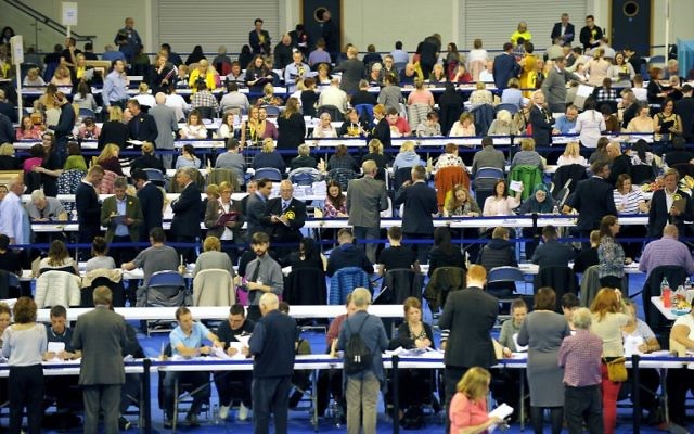 Counting staff count ballots at the main Glasgow counting center in Emirates Arena in Glasgow, Scotland, on June 8, 2017, after the polls closed in Britain's general election.(AFP PHOTO / Andy Buchanan) Counting staff count ballots at the main Glasgow counting center in Emirates Arena in Glasgow, Scotland, on June 8, 2017, after the polls closed in Britain's general election.(AFP PHOTO / Andy Buchanan)