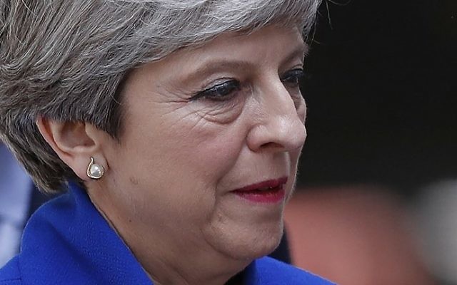Britain's Prime Minister and leader of the Conservative Party Theresa May delivers a statement outside 10 Downing Street in central London on June 9, 2017 as results from a snap general election show the Conservatives have lost their majority. (AFP/Adrian Dennis)
