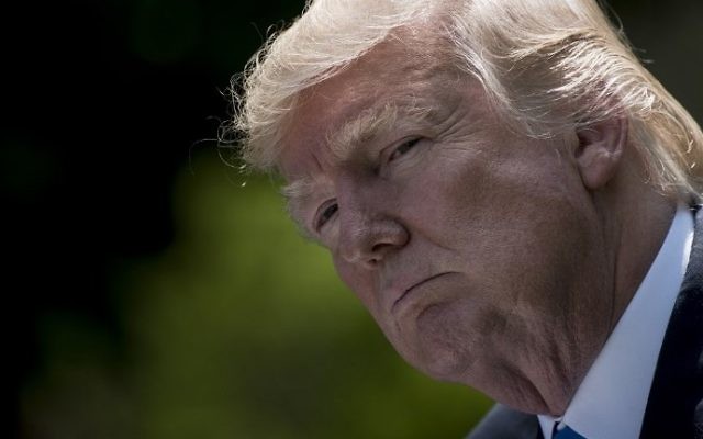 US President Donald Trump pauses during a press conference with Romania's President Klaus Iohannis in the Rose Garden of the White House June 9, 2017 in Washington, DC. (AFP/Brendan Smialowski) US President Donald Trump pauses during a press conference with Romania's President Klaus Iohannis in the Rose Garden of the White House June 9, 2017 in Washington, DC. (AFP/Brendan Smialowski)