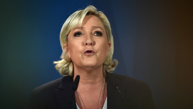 France's far-right National Front (FN) leader and parliamentary candidate Marine Le Pen gives a speech after polls closed for the first round of the French legislative elections in Paris, on June 11, 2017. (Denis Charlet / AFP) France's far-right National Front (FN) leader and parliamentary candidate Marine Le Pen gives a speech after polls closed for the first round of the French legislative elections in Paris, on June 11, 2017. (Denis Charlet / AFP)