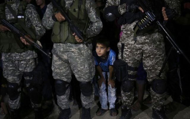 Fighters from the Izz-a-Din al-Qassam Brigades, the armed wing of the Palestinian Hamas terror movement, attend a memorial service for a commander killed in an apparently accidental explosion inn the southern Gaza Strip on June 10, 2017. (AFP/SAID KHATIB)