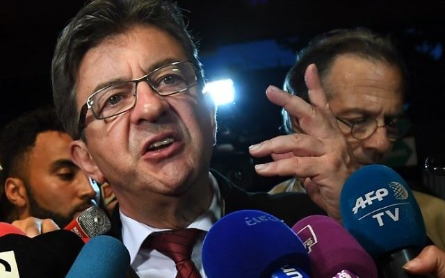 La France Insoumise (LFI) Leader Jean-Luc Melenchon (C) gestures as he addresses media representatives in Marseille on June 11, 2017, after polls closed for the first round of the French legislative elections. (AFP/Anne-Christine Poujoulat) La France Insoumise (LFI) Leader Jean-Luc Melenchon (C) gestures as he addresses media representatives in Marseille on June 11, 2017, after polls closed for the first round of the French legislative elections. (AFP/Anne-Christine Poujoulat)