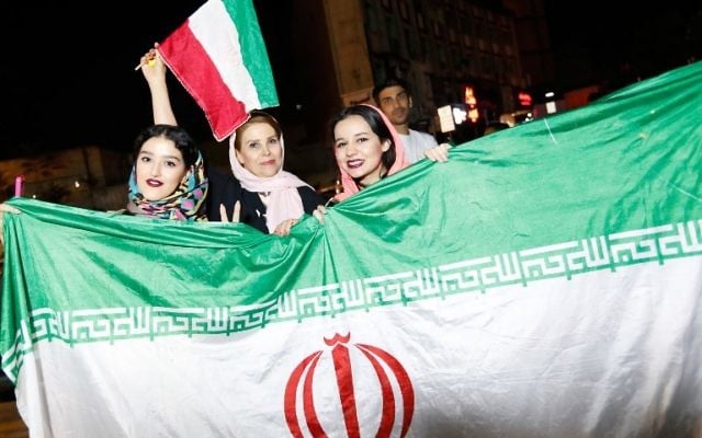 Illustrative: Iranians celebrate on the streets of Tehran on June 13, 2017, after the Iranian national soccer team won the 2018 World Cup qualifying match between Iran and Uzbekistan. (AFP Photo) Illustrative: Iranians celebrate on the streets of Tehran on June 13, 2017, after the Iranian national soccer team won the 2018 World Cup qualifying match between Iran and Uzbekistan. (AFP Photo)