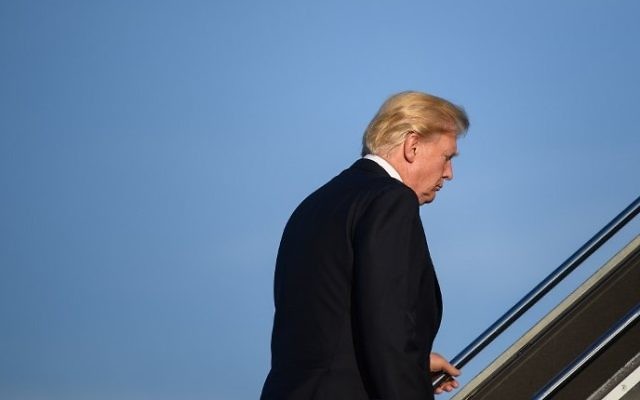 US President Donald Trump makes his way to board Air Force One before departing from Newark Liberty Airport in Newark, New Jersey, June 11, 2017. (AFP/MANDEL NGAN) US President Donald Trump makes his way to board Air Force One before departing from Newark Liberty Airport in Newark, New Jersey, June 11, 2017. (AFP/MANDEL NGAN)