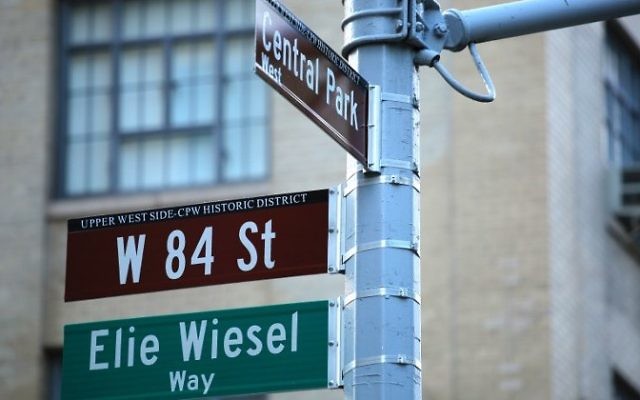 The street signs on the southwest corner of 84th Street and Central Park West are seen following a ceremony to permanently co-name the street with the late humanitarian and Nobel Peace Prize-winning name of Elie Wiesel, June 13, 2017 in New York. (AFP/ Kena Betancur) The street signs on the southwest corner of 84th Street and Central Park West are seen following a ceremony to permanently co-name the street with the late humanitarian and Nobel Peace Prize-winning name of Elie Wiesel, June 13, 2017 in New York. (AFP/ Kena Betancur)