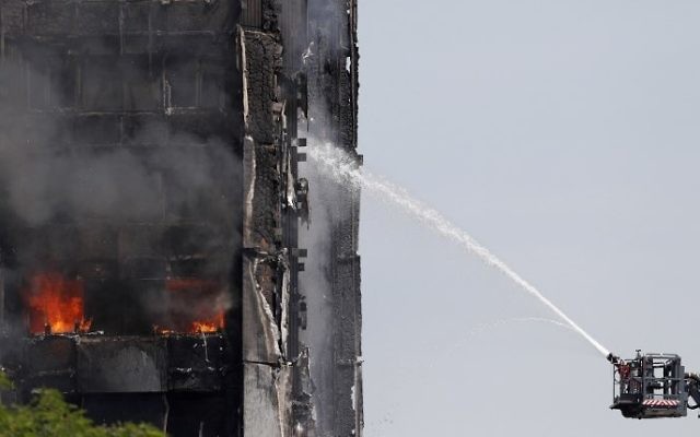 Smoke billows from Grenfell Tower as firefighters attempt to control a blaze at a residential block of flats on June 14, 2017 in west London. (AFP PHOTO / Adrian DENNIS