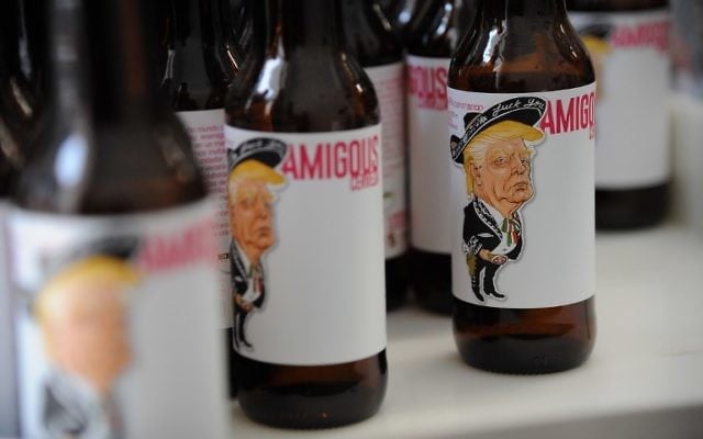 View of Amigous Craft Beer, whose bottle shows an image of US President Donald Trump wearing a mariachi costume and swastika belt buckle, in Mexico City, on June 15, 2017. (AFP PHOTO/Bernardo Montoya) View of Amigous Craft Beer, whose bottle shows an image of US President Donald Trump wearing a mariachi costume and swastika belt buckle, in Mexico City, on June 15, 2017. (AFP PHOTO/Bernardo Montoya)