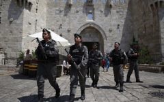 Border Police officers outside Damascus Gate in Jerusalem's Old City on June 18, 2017. (AFP/Ahmad Gharabli)