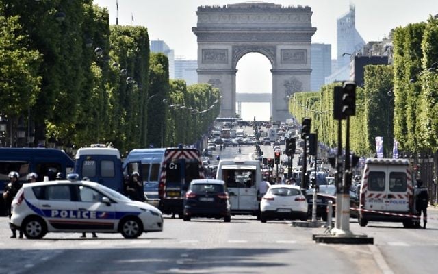 Illustrative: Police seal off the Champs-Elysees avenue after a believed terror attack targeted police, in Paris, June 19, 2017. (AFP/Alain Jocard) Illustrative: Police seal off the Champs-Elysees avenue after a believed terror attack targeted police, in Paris, June 19, 2017. (AFP/Alain Jocard)