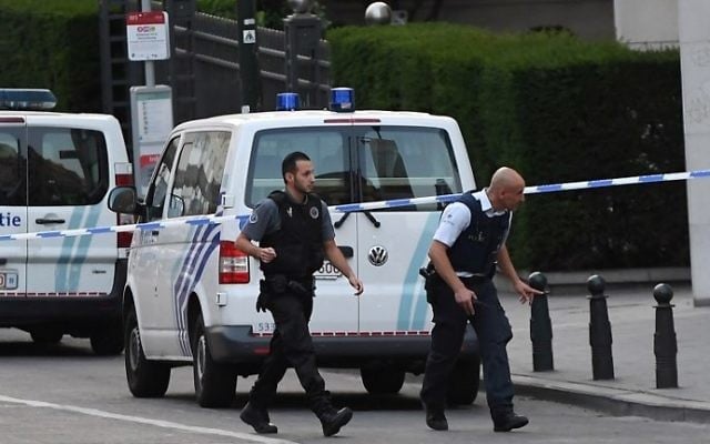 Police officials walk in a cordoned off area outside Gare Centrale in Brussels on June 20, 2017, after an explosion in the Belgian capital.  (AFP PHOTO / Emmanuel DUNAND)