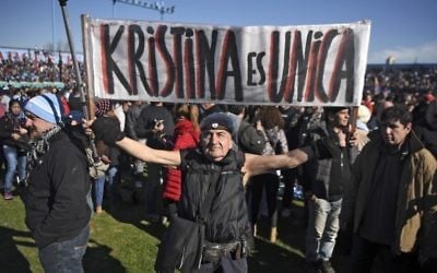 A supporter of Argentinian former President (2007-2015) Cristina Kirchner holds a banner reading 'Cristina is unique' during a rally in Buenos Aires on June 20, 2017 (AFP PHOTO / EITAN ABRAMOVICH)