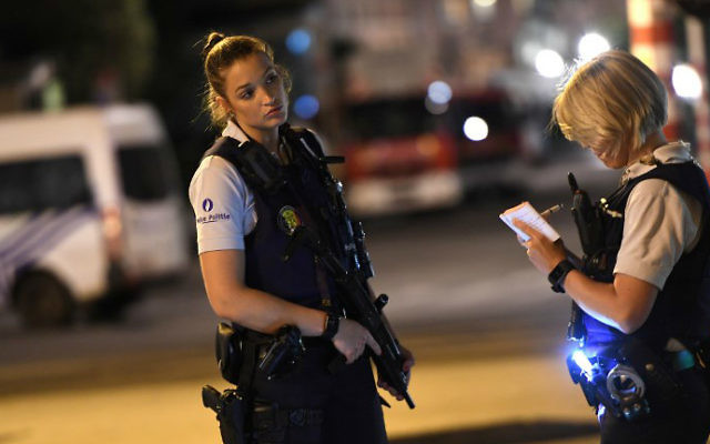 Police officers on a street outside Gare Centrale in Brussels on June 20, 2017, after an explosion. (Emmanuel Dunand/AFP)
