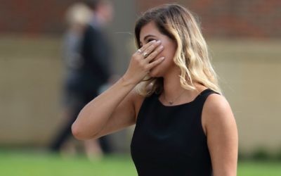 A mourner is seen leaving Wyoming High School in Wyoming, Ohio on June 22, 2017, following the funeral for Otto Warmbier. (AFP PHOTO / Paul Vernon)