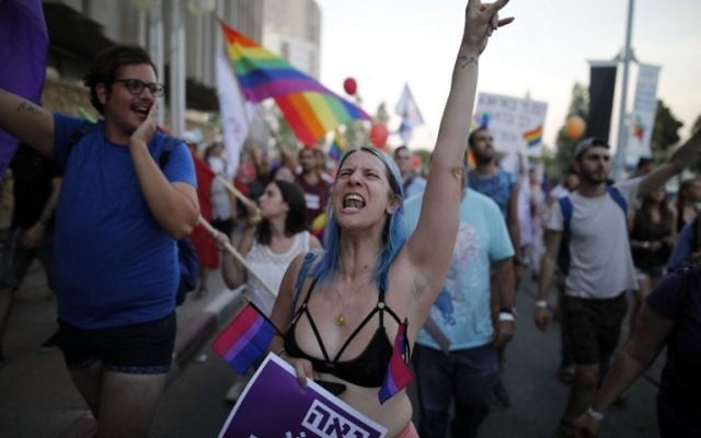 Israelis take part in the first annual Gay Pride parade in the southern Israeli city of Beersheba, on June 22, 2017.(AFP PHOTO / MENAHEM KAHANA)