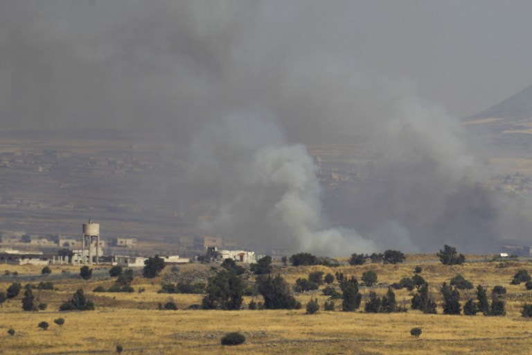 A picture taken from the Israeli Golan Heights shows smoke billowing from the Syrian side of the border on June 24, 2017. (AFP PHOTO / JALAA MAREY) A picture taken from the Israeli Golan Heights shows smoke billowing from the Syrian side of the border on June 24, 2017. (AFP PHOTO / JALAA MAREY)
