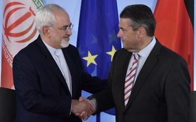 German Vice Chancellor and Foreign Minister Sigmar Gabriel (R) and his Iranian counterpart Mohammad Javad Zarif shake hands after a press conference at the Foreign Ministry in Berlin on June 27, 2017. (John Macdougall/AFP) 