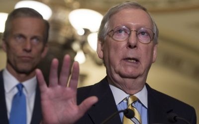 US Senate Majority Leader Mitch McConnell (R), Republican of Kentucky, speaks about the Senate Republican's healthcare bill alongside US Senator John Thune (L), Republican of South Dakota, at the US Capitol in Washington, DC, June 27, 2017. (AFP/ SAUL LOEB)