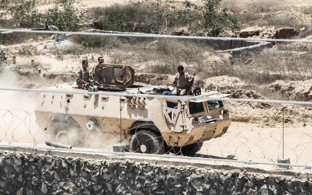 A picture taken on June 28, 2017 from the Gaza strip border-town of Rafah shows Egyptian border guards patrolling on the other side of the border while riding in an armored personnel carrier. (AFP PHOTO / SAID KHATIB) A picture taken on June 28, 2017 from the Gaza strip border-town of Rafah shows Egyptian border guards patrolling on the other side of the border while riding in an armored personnel carrier. (AFP PHOTO / SAID KHATIB)
