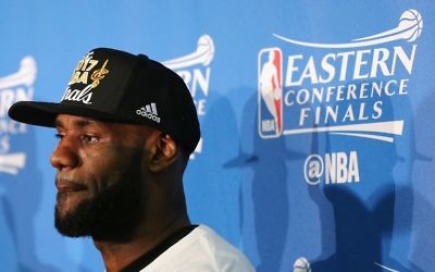 LeBron James of the Cleveland Cavaliers looks on during the trophy presentation after Game Five of the 2017 NBA Eastern Conference Finals, May 25, 2017. (Elsa/Getty Images/AFP)