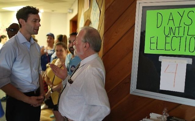Democratic candidate Jon Ossoff speaks with Perry Taylor, Jr as he visits his Sandy Springs Field Office to thank volunteers as he runs for Georgia's 6th Congressional District on June 17, 2017 in Sandy Springs, Georgia. Joe Raedle/Getty Images/AFP) Democratic candidate Jon Ossoff speaks with Perry Taylor, Jr as he visits his Sandy Springs Field Office to thank volunteers as he runs for Georgia's 6th Congressional District on June 17, 2017 in Sandy Springs, Georgia. Joe Raedle/Getty Images/AFP)