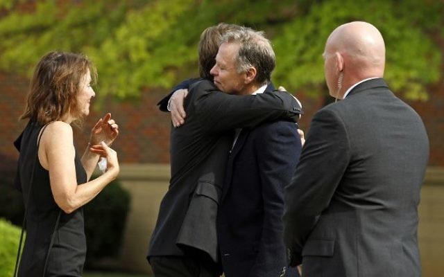 Fred and Cindy Warmbier greet guest during the funeral for their son Otto Warmbier at Wyoming High School June 22, 2017 in Wyoming, Ohio.(Bill Pugliano/Getty Images/AFP)