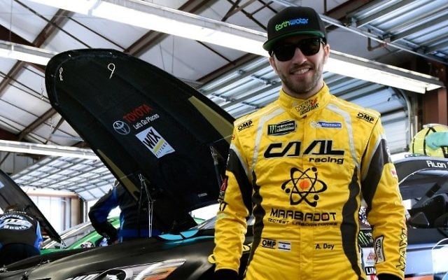  Alon Day, driver of the #23 earthwater Toyota, stands in front of his car during practice for the Monster Energy NASCAR Cup Series Toyota/Save Mart 350 at Sonoma Raceway on June 23, 2017 in Sonoma, California. (Jared C. Tilton/Getty Images/AFP)