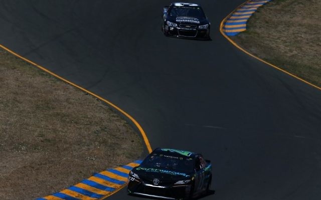 Alon Day, driver of the #23 earthwater Toyota, and Ryan Newman, driver of the #31 Chevrolet Accessories Chevrolet, drive during practice for the Monster Energy NASCAR Cup Series Toyota/Save Mart 350 at Sonoma Raceway on June 23, 2017 in Sonoma, California. (Sarah Crabill/Getty Images/AFP)
