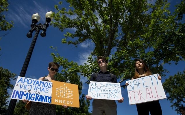 People protest outside the US Supreme Court after it was announced that the court will allow a limited version of President Donald Trump's travel ban to take effect June 26, 2017 in Washington, DC. (Eric Thayer/Getty Images/AFP)