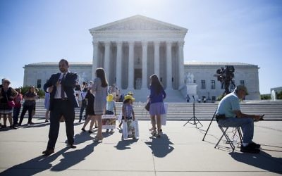 Illustrative: Outside the US Supreme Court, after it was announced that the court will allow a limited version of US President Donald Trump's travel ban to take effect, June 26, 2017, in Washington, DC. (Eric Thayer/Getty Images/ AFP)
