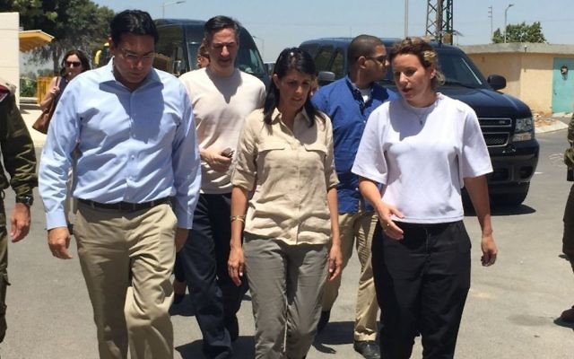 US Ambassador to the UN Nikki Haley, accompanied by Israeli Ambassador to the UN Danny Danon, left, visits with residents of Kibbutz Nahal Oz, June 8, 2017. (Courtesy)