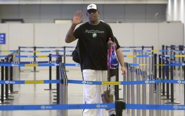 Former NBA basketball player Dennis Rodman gestures to photographers as he prepares to go through immigration at Beijing Capital International Airport in Beijing, Tuesday, June 13, 2017. (AP Photo/Mark Schiefelbein) Former NBA basketball player Dennis Rodman gestures to photographers as he prepares to go through immigration at Beijing Capital International Airport in Beijing, Tuesday, June 13, 2017. (AP Photo/Mark Schiefelbein)