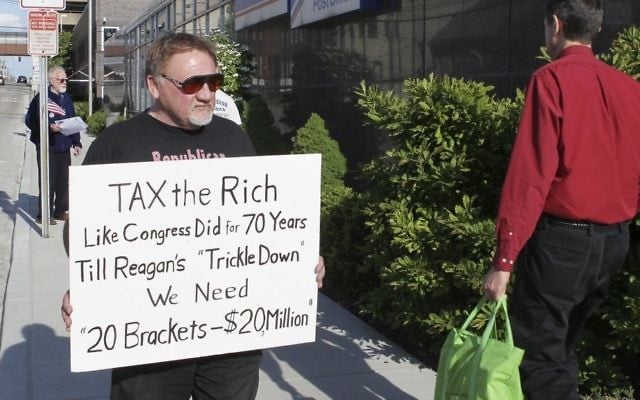 James Hodgkinson protests outside the United States Post Office in Downtown Belleville, Illinois, April 17, 2012. (Derik Holtmann/Belleville News-Democrat, via AP) 