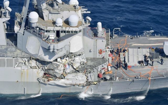 The damage of the right side of the USS Fitzgerald is seen off Shimoda, Shizuoka prefecture, Japan, after the Navy destroyer collided with a merchant ship, Saturday, June 17, 2017. (Iori Sagisawa/Kyodo News via AP) The damage of the right side of the USS Fitzgerald is seen off Shimoda, Shizuoka prefecture, Japan, after the Navy destroyer collided with a merchant ship, Saturday, June 17, 2017. (Iori Sagisawa/Kyodo News via AP)